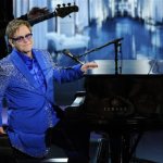  Elton John performs "Home Again" at the 65th Primetime Emmy Awards at Nokia Theatre on Sunday Sept. 22, 2013, in Los Angeles. (Photo by Chris Pizzello/Invision/AP)
