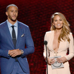 Colin Kaepernick, left, and Chrissy Teigen present the award for best female athlete at the ESPY Awards at the Nokia Theatre on Wednesday, July 16, 2014, in Los Angeles. (Photo by John Shearer/Invision/AP)