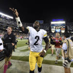 Pittsburgh Steelers quarterback Mike Vick celebrates defeating the San Diego Chargers after an NFL football game on Monday in San Diego. The Steelers won 24-20. (AP Photo/Denis Poroy)