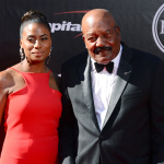 NFL legend Jim Brown, right, and Monique Brown arrive at the ESPY Awards at the Nokia Theatre on Wednesday, July 16, 2014, in Los Angeles. (Photo by Jordan Strauss/Invision/AP)