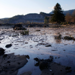  Water and mud back up on the east side of Saturday's fatal mudslide near Oso, Wash., Sunday March 23, 2014. (AP Photo /The Herald, Genna Martin)
            