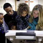 Jennifer Shiberou, right, votes with her children, from left, Sophie Pauti, 10, Yakube Pauti, 16, Samuel Shiberou, 7, and Addis Shiberou, 4, at the Trinity United Methodist Church on Election Day, Tuesday, Nov. 6, 2012, in Memphis, Tenn. (AP Photo/The Commercial Appeal, Mark Weber)