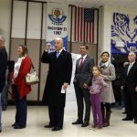Vice President Joe Biden, accompanied by his son Beau Biden, his wife, Hallie and their daughter Natalie, stands in line to cast his ballot at Alexis I. duPont High School, Tuesday, Nov. 6, 2012, in Greenville, Del. (AP Photo/Matt Rourke)