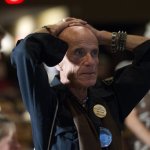  Dennis Eugene Hatton reacts while watching televised reports on the presidential election at an Obama watch party in Fort Myers, Fla., Tuesday, Nov. 6, 2012. (AP Photo/J Pat Carter)