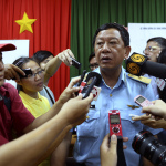 Vietnamese Major Gen. Do Minh Tuan, deputy commander of Vietnam Air Force, answers to the media about the search operation for missing Malaysian Airlines Boeing 777 over the seas between Malaysia and Vietnam on Tuesday, March 11, 2014 at a press conference at Phu Quoc airport, Kien Giang province, Vietnam. Authorities hunting for the missing jetliner expanded their search on land and sea Tuesday, reflecting the difficulties in finding traces of the plane more than three days after it vanished with 239 people on board. (AP Photo)
