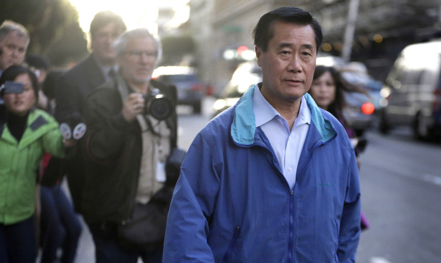 In this March 26, 2014 photo, California state Sen. Leland Yee, D-San Francisco, right, leaves the ...