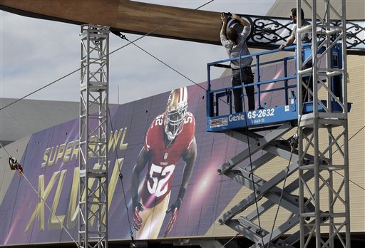Tom Douglas says the best Super Bowl snack represents three cities. (AP Photo/Mark Humphrey)...