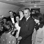 FILE - In this Friday, Nov. 22, 1963 photo from the White House via the John Fitzgerald Kennedy Library in Boston, Lyndon B. Johnson is sworn in as president as Jacqueline Kennedy stands at his side in the cabin of the presidential plane on the ground at Love Field in Dallas. Judge Sarah T. Hughes, a Kennedy appointee to the Federal court, left, administers the oath. In background, from left are, Associate Press Secretary Malcolm Kilduff, holding microphone; Jack Valenti, administrative assistant to Johnson; Rep. Albert Thomas, D-Texas.; Lady Bird Johnson; and Rep. Jack Brooks, D-Texas. (AP Photo/White House, Cecil Stoughton, via the John Fitzgerald Kennedy Library, Boston)