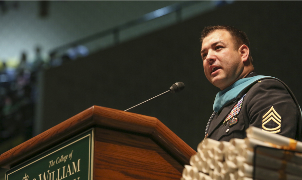 Medal of Honor recipient U.S. Army Sgt. 1st Class Leroy A. Petry addresses the class of 2014 at the...