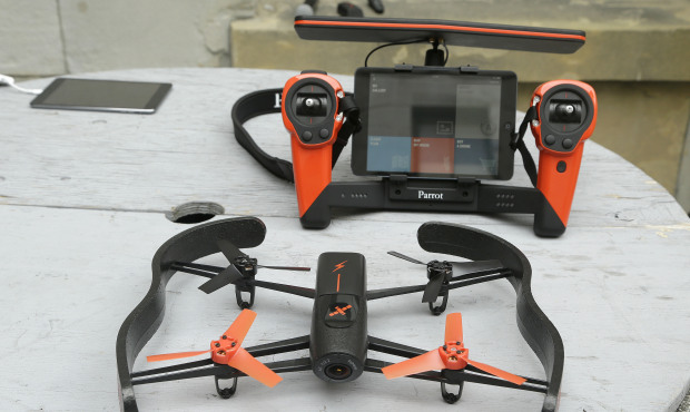 This May 8, 2014 file photo shows a Parrot Bebop drone, foreground, and the Skycontroller, at a Par...