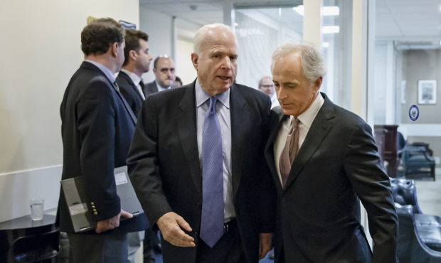 Sen. Bob Corker, R-Tenn., right, walks with Sen. John McCain, R-Ariz., on Capitol Hill in Washingto...
