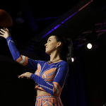 Katy Perry throws a football at a halftime news conference for NFL Super Bowl XLIX football game Thursday, Jan. 29, 2015, in Phoenix. (AP Photo/David J. Phillip)