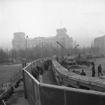FILE - The Nov. 20, 1961 photo shows 12 feet high boards hiding the work as East German troops erect a new concrete wall at the Brandenburg Gate, marking the East-West border in Berlin. In background is the former Reichstag building which is in West Berlin. (AP Photo/file)