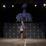 Katy Perry answers questions at a halftime news conference for NFL Super Bowl XLIX football game Thursday, Jan. 29, 2015, in Phoenix. (AP Photo/Morry Gash)