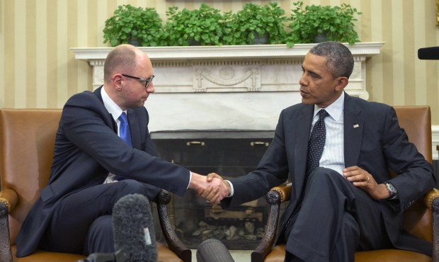 President Barack Obama, right, and Ukraine Prime Minister Arseniy Yatsenyuk, left, shake hands in t...