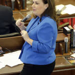 Rep. Tricia Ann Cotham, D-Mecklenburg, speaks on the House floor as North Carolina lawmakers gather for a special session Wednesday, March 23, 2016 in Raleigh, N.C. Lawmakers will consider stopping a new Charlotte ordinance set to take effect April 1 that gives protections to transgender people to use the restroom of their gender identity. (AP Photo/Gerry Broome)