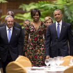 President Barack Obama, right, and first lady Michelle arrive for a state dinner with Cuba's President Raul Castro, left, at the Palace of the Revolution in Havana, Cuba, Monday, March 21, 2016. Obama's visit to Cuba is a crowning moment in his and Castro's bid to normalize ties between two countries that sit just 90 miles apart. 