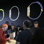 Members of the media and Apple guests get a look at the new Apple Watch and new MacBook in the demo room after an Apple event on Monday, March 9, 2015, in San Francisco. Pre-orders for the Apple Watch start April 10. The device costs $349 for a base model, while a luxury gold version will go for $10,000. (AP Photo/Eric Risberg)