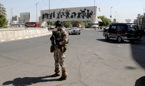 An Iraqi army soldier stands guard at Tahrir Square in Baghdad, Iraq. We’re hearing that a sm...