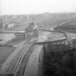 FILE - The Nov. 19, 1961 file photo shows a view from top of the old Reichstag's building to the Brandenburg Gate, which marks the border in this divided city. The semi-circled wall around the Brandenburg Gate was erected by East German police. (AP Photo/E.Worth, file)